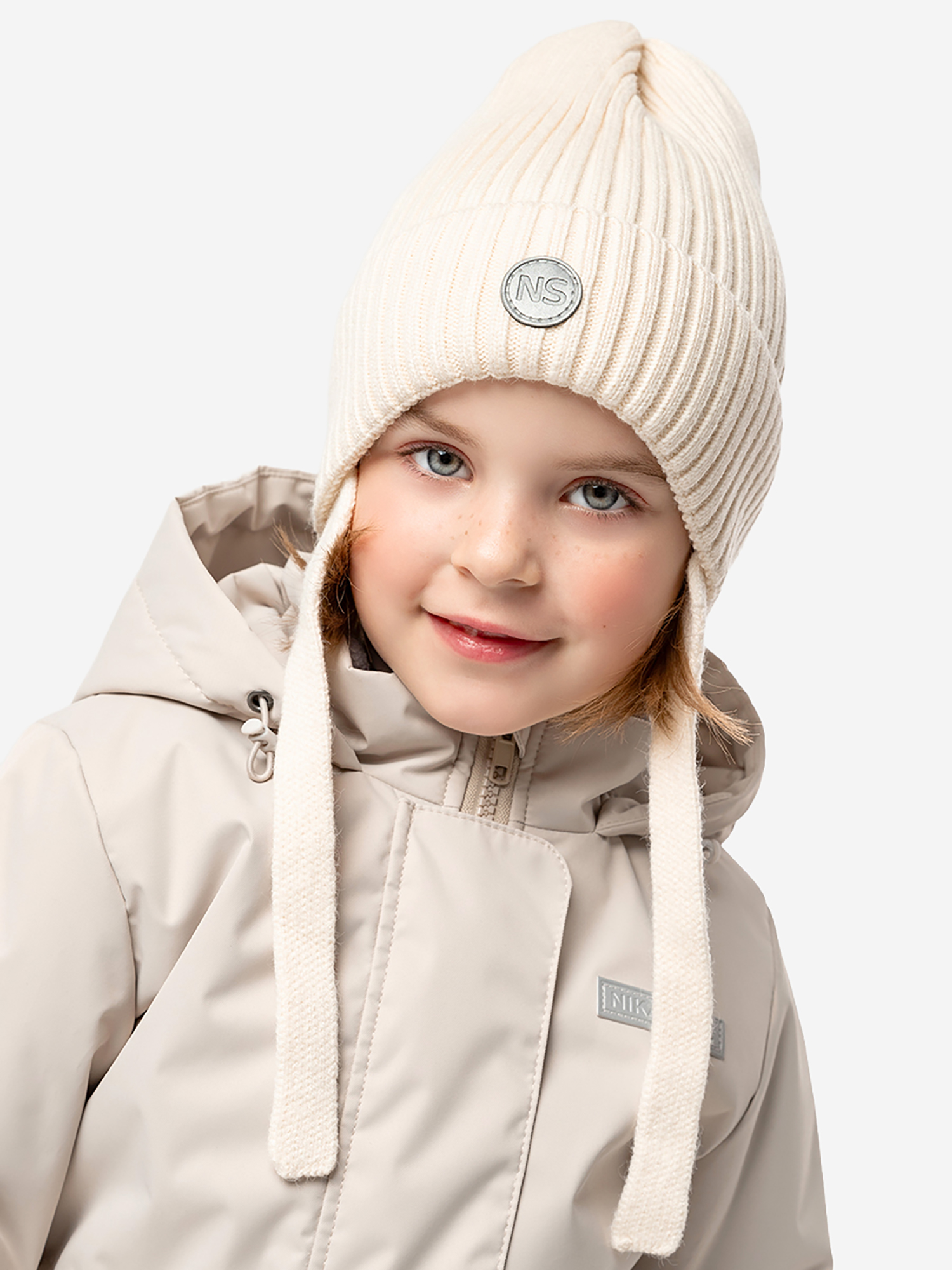 Изображение товара Шапка NIKASTYLE Молоко для детей демисезонная спортивная